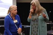 attendees conversing at conference